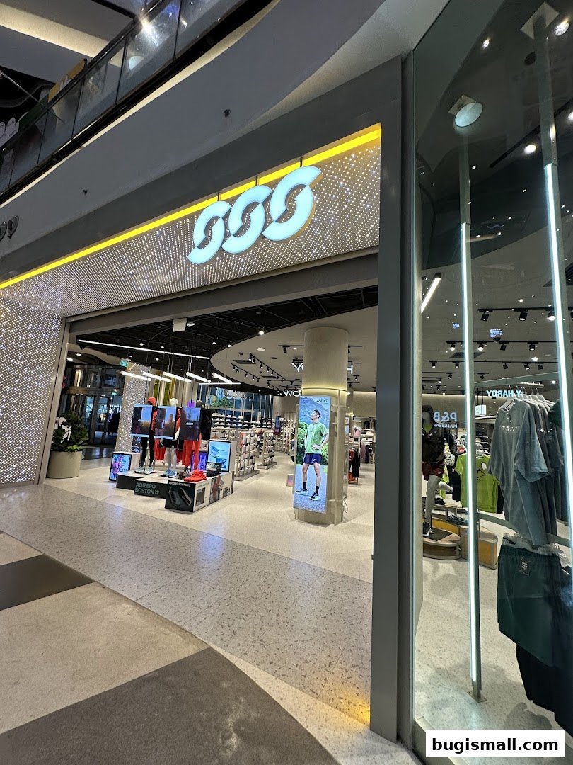 The entrance of Sun Sand Sports store with its prominent logo and display of athletic wear.