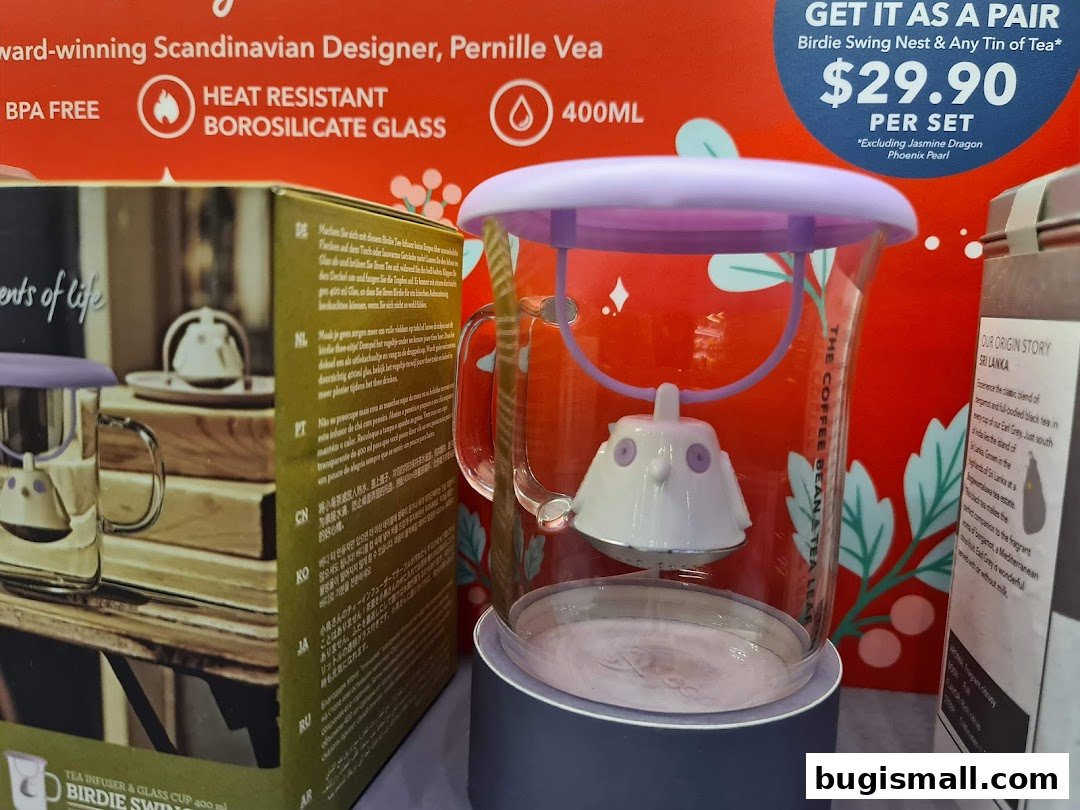 A display of The Coffee Bean & Tea Leaf's Birdie Swing Nest tea infuser and glass cup.