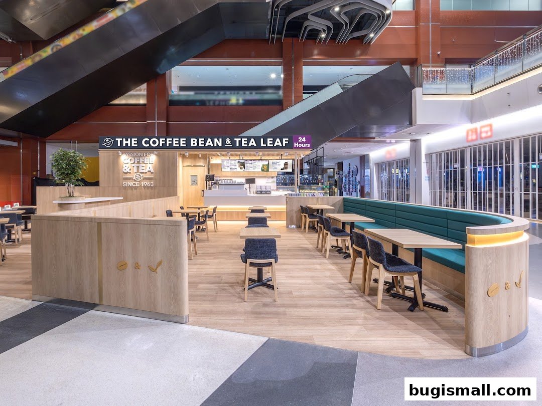 Interior view of The Coffee Bean & Tea Leaf cafe with seating and counter.