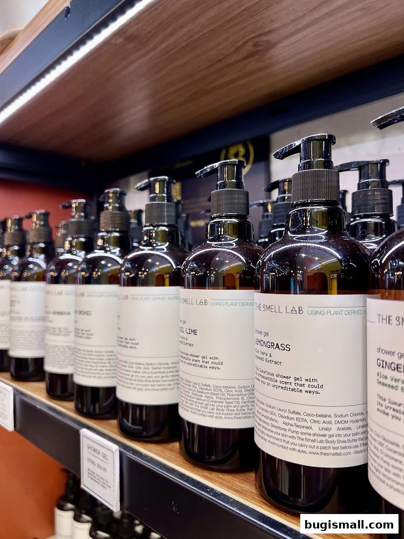 A close-up view of several bottles of shower gel from The Smell Lab on a shelf.