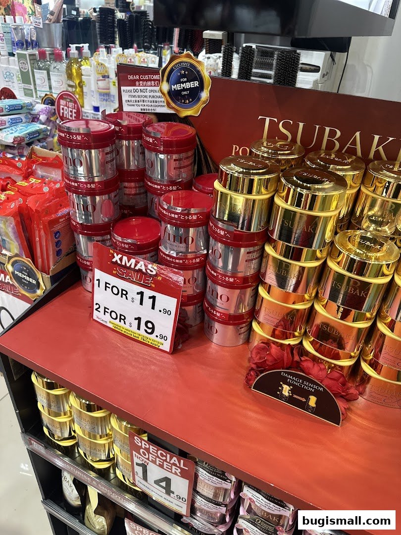 A display of hair care products, including Tsubaki hair masks, with Christmas sale promotions.