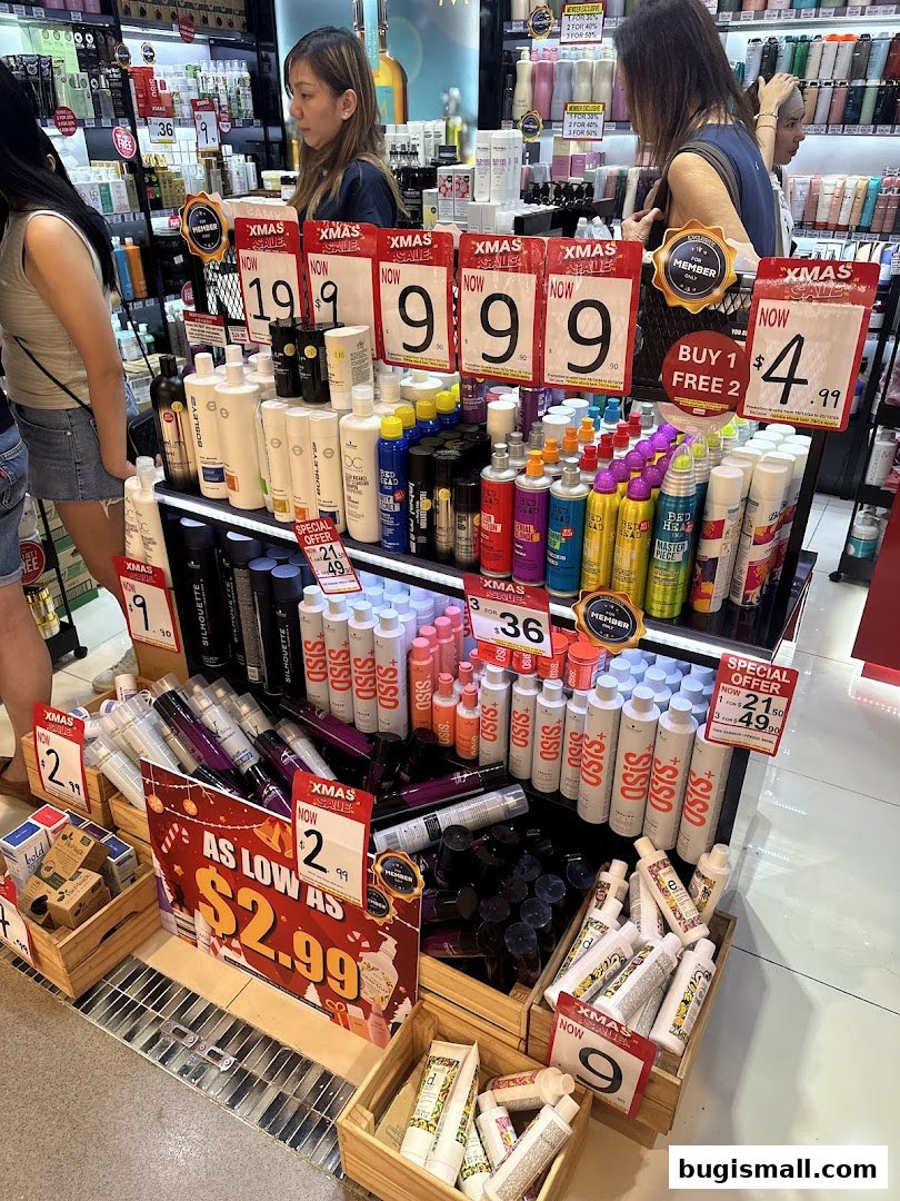 A retail store display featuring various hair and beauty products with prominent sale signs.