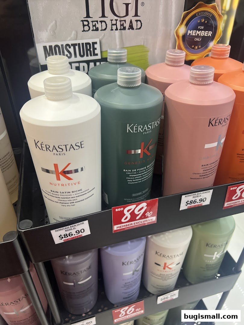 A display of various Kérastase hair care products, including shampoos and conditioners, on shelves.
