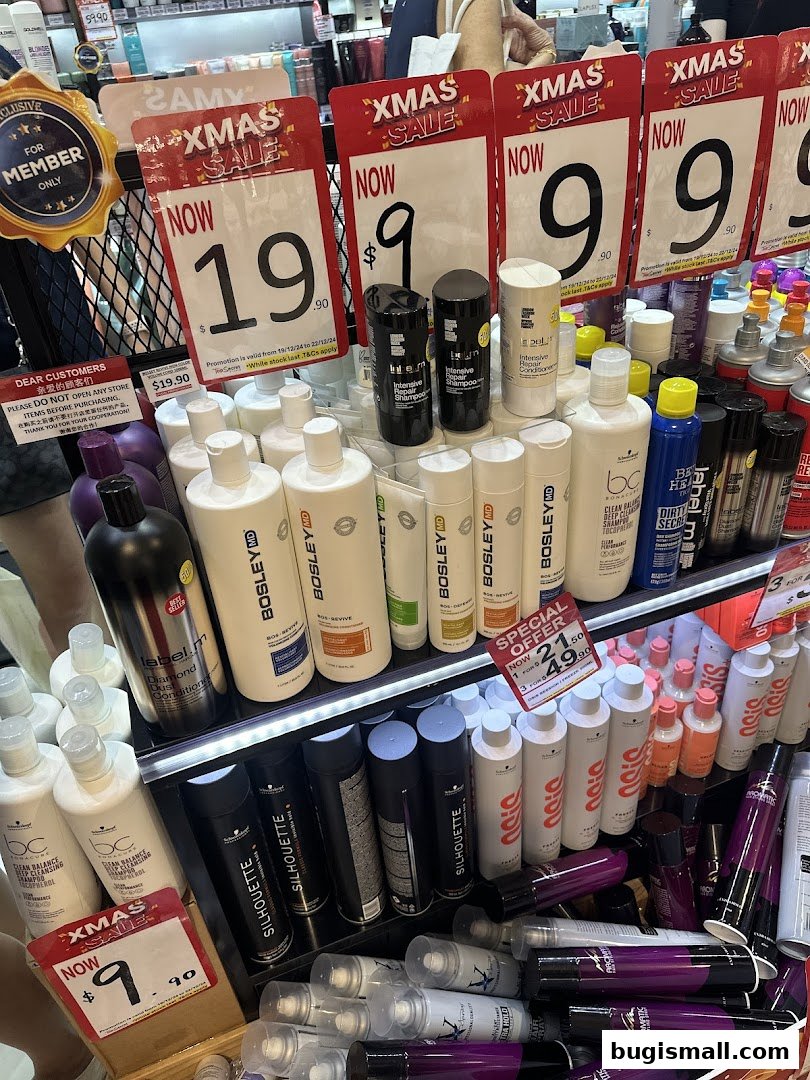 A display of hair care products with prominent Christmas sale signs and prices.