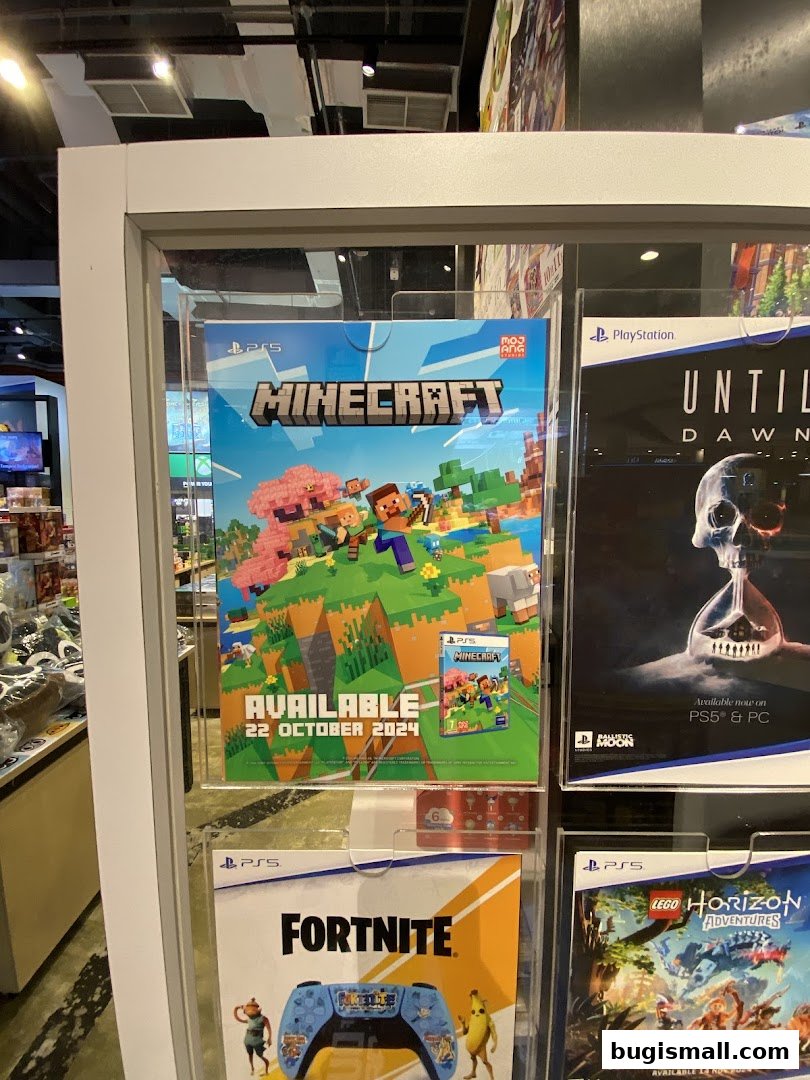 A display case in a game store featuring posters for Minecraft, Until Dawn, Fortnite, and Lego Horizon Adventures.