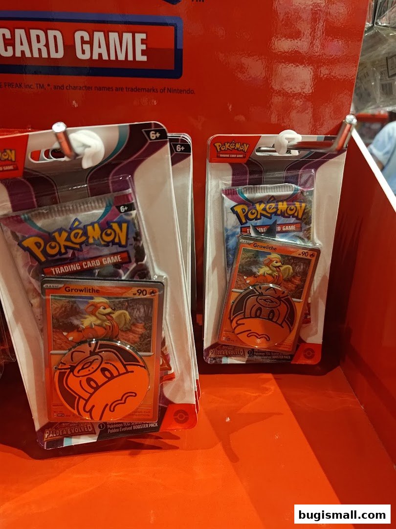 Packs of Pokemon Trading Card Game with Growlithe cards and coins.