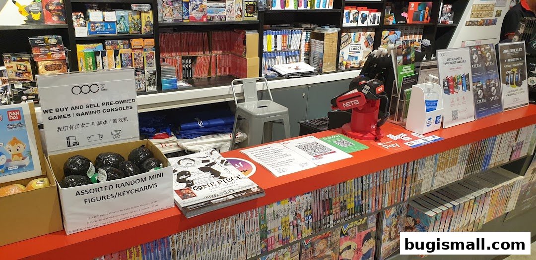 A retail shop counter displaying games, keychains, and payment options, with shelves stocked with merchandise.