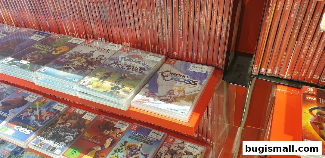 A display of various Nintendo Switch game cases on shelves, featuring popular titles.