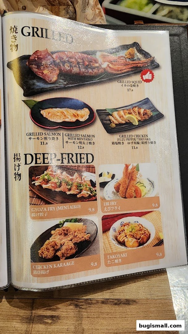 A menu featuring grilled and deep-fried Japanese dishes, including squid, salmon, chicken, gyoza, shrimp, and takoyaki.