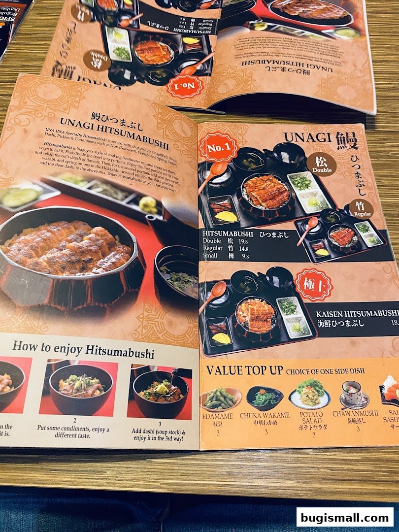 A menu from Una Una restaurant showcasing Unagi Hitsumabushi and other dishes.