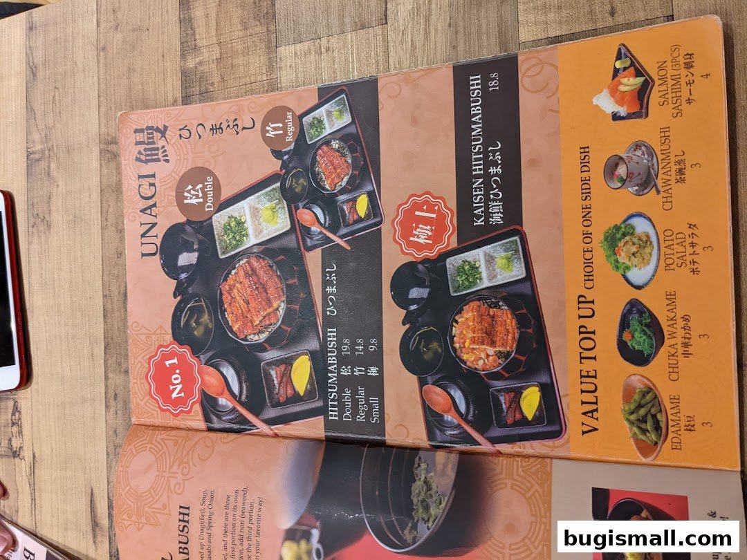 A menu from Una Una featuring Unagi Hitsumabushi and Kaisen Hitsumabushi with side dish options.