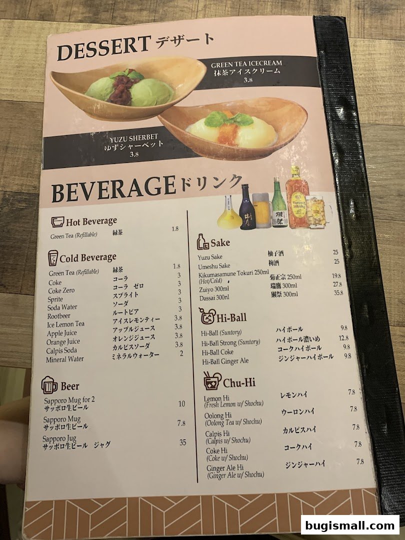 A menu featuring desserts like Yuzu Sherbet and Green Tea Ice Cream, and various beverages including sake, hi-balls, and chu-his.