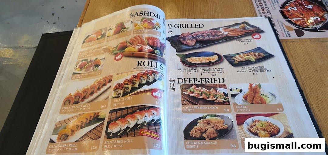 A menu from Una Una featuring sashimi, rolls, grilled, and deep-fried Japanese dishes.