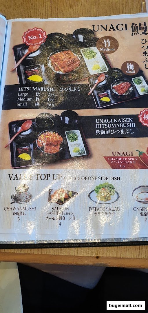 A menu featuring Unagi dishes, including Hitsumabushi and Kaisen Hitsumabushi, with side dish options.