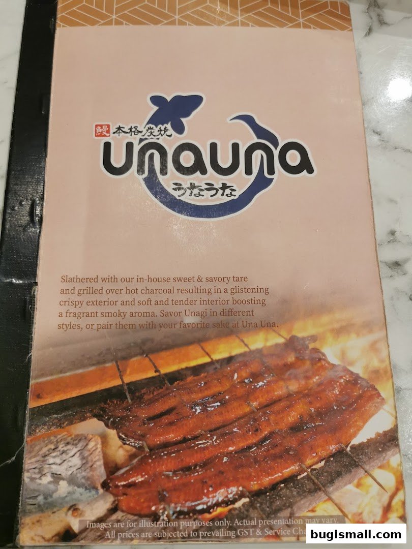 A menu cover for Una Una restaurant featuring grilled eel and descriptive text.
