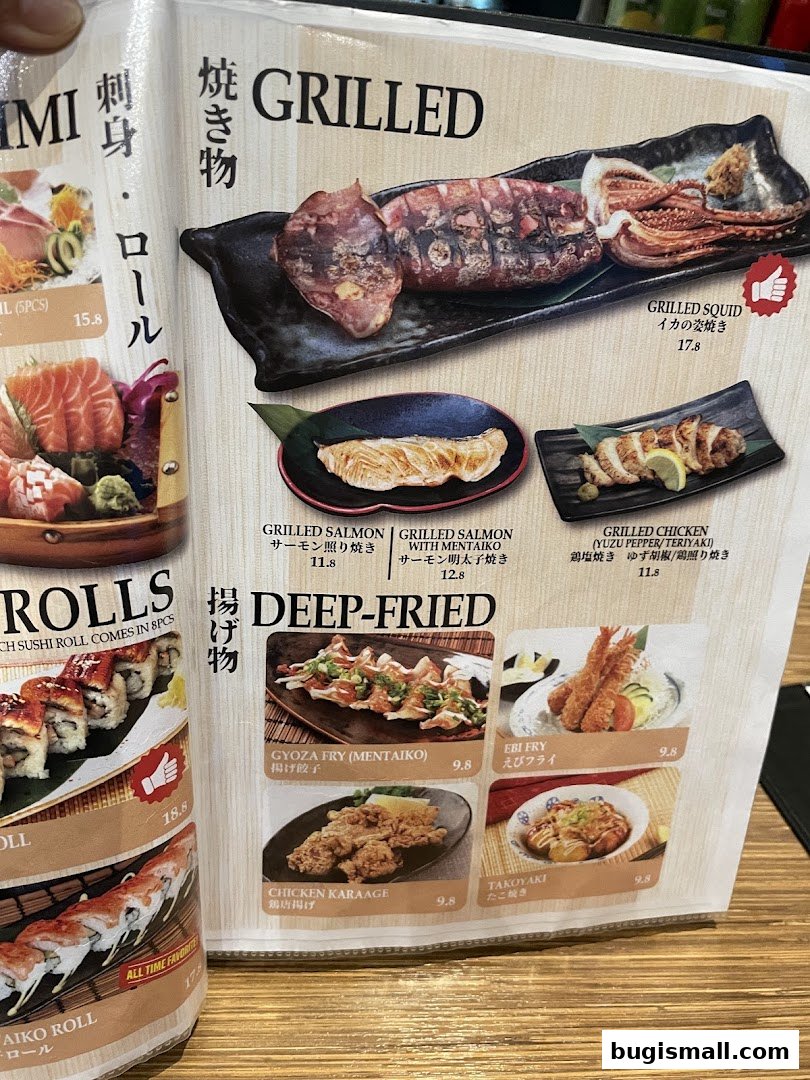 A menu page showcasing grilled and deep-fried Japanese dishes, including squid, salmon, chicken, gyoza, and takoyaki.