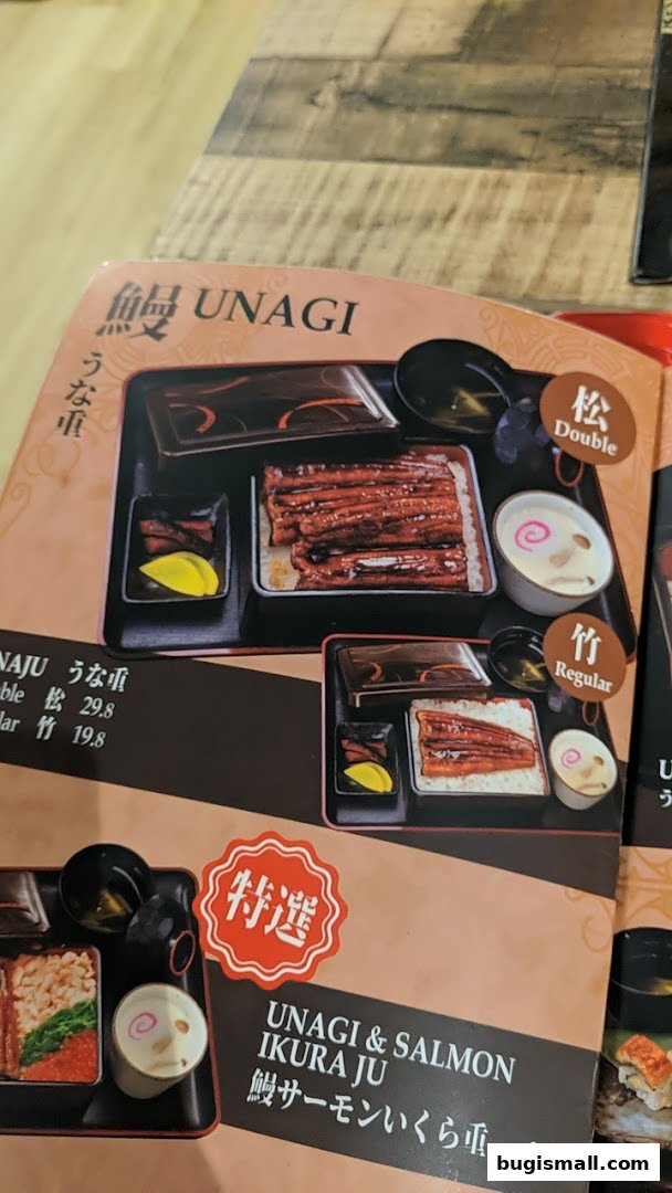 A menu showcasing Unagi dishes, including Unagi Ju and Unagi & Salmon Ikura Ju.