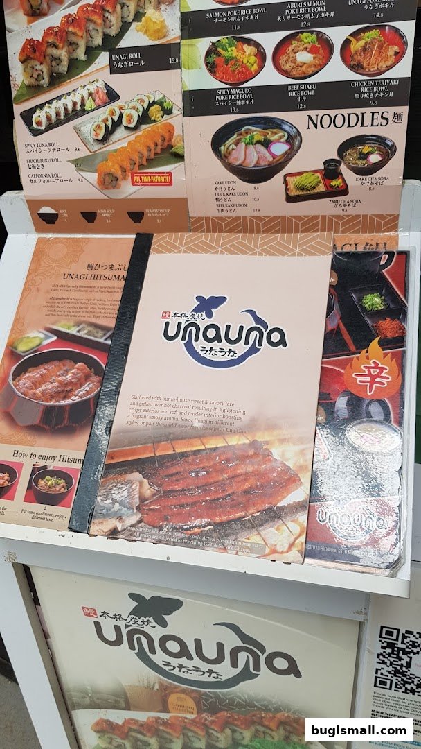 A menu display for Una Una restaurant featuring sushi, poke bowls, and noodles.