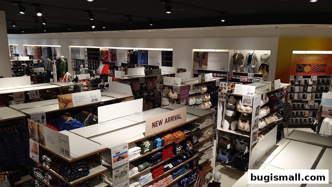 Interior view of a UNIQLO store showcasing clothing displays and mannequins.