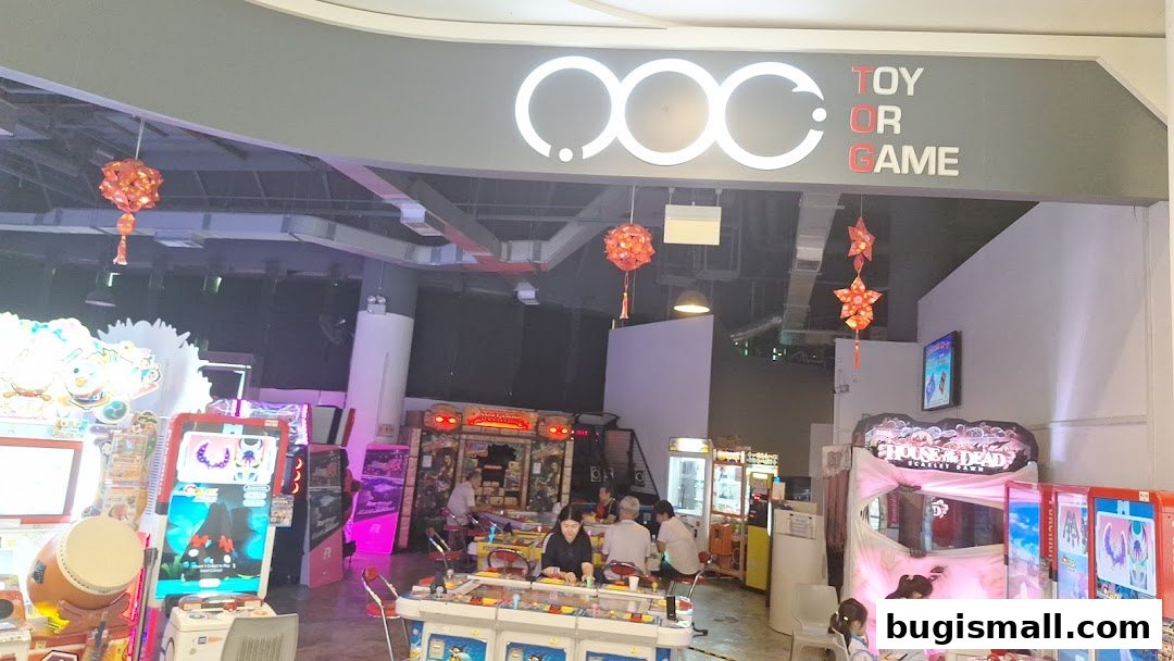 An arcade with various game machines and people playing.