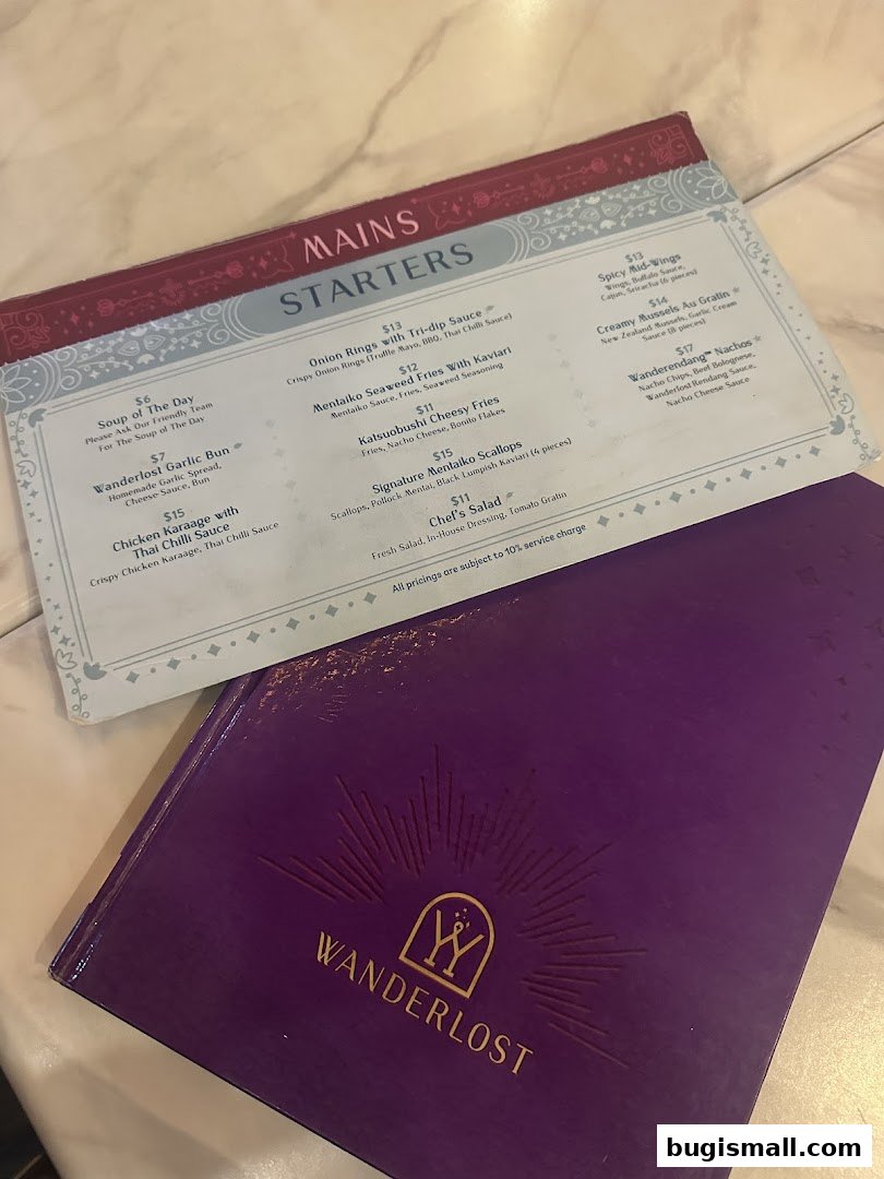 A menu from Wanderlost Lounge featuring starters and mains with various dishes and prices.