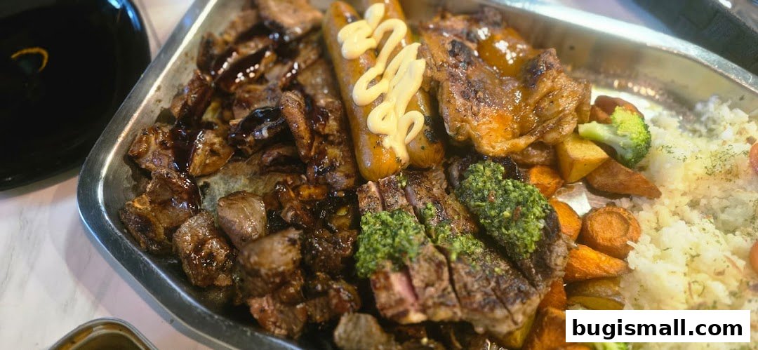 A platter of grilled meats, sausages, rice, and vegetables, served with a side of sauce.