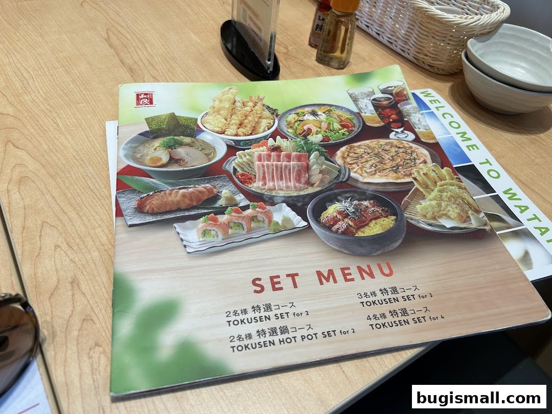 A menu from Watami Japanese Dining showcasing various set meals and Japanese dishes.
