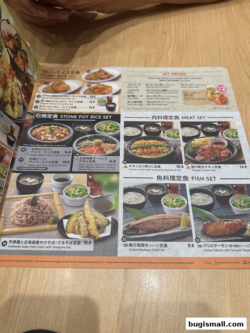 A menu from Watami Japanese Dining featuring various Japanese set meals with pictures and prices.