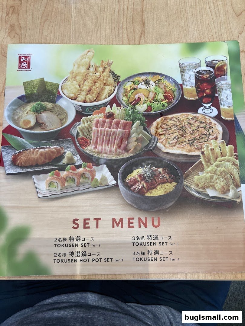A menu from Watami Japanese Dining featuring various set meals and Japanese cuisine.