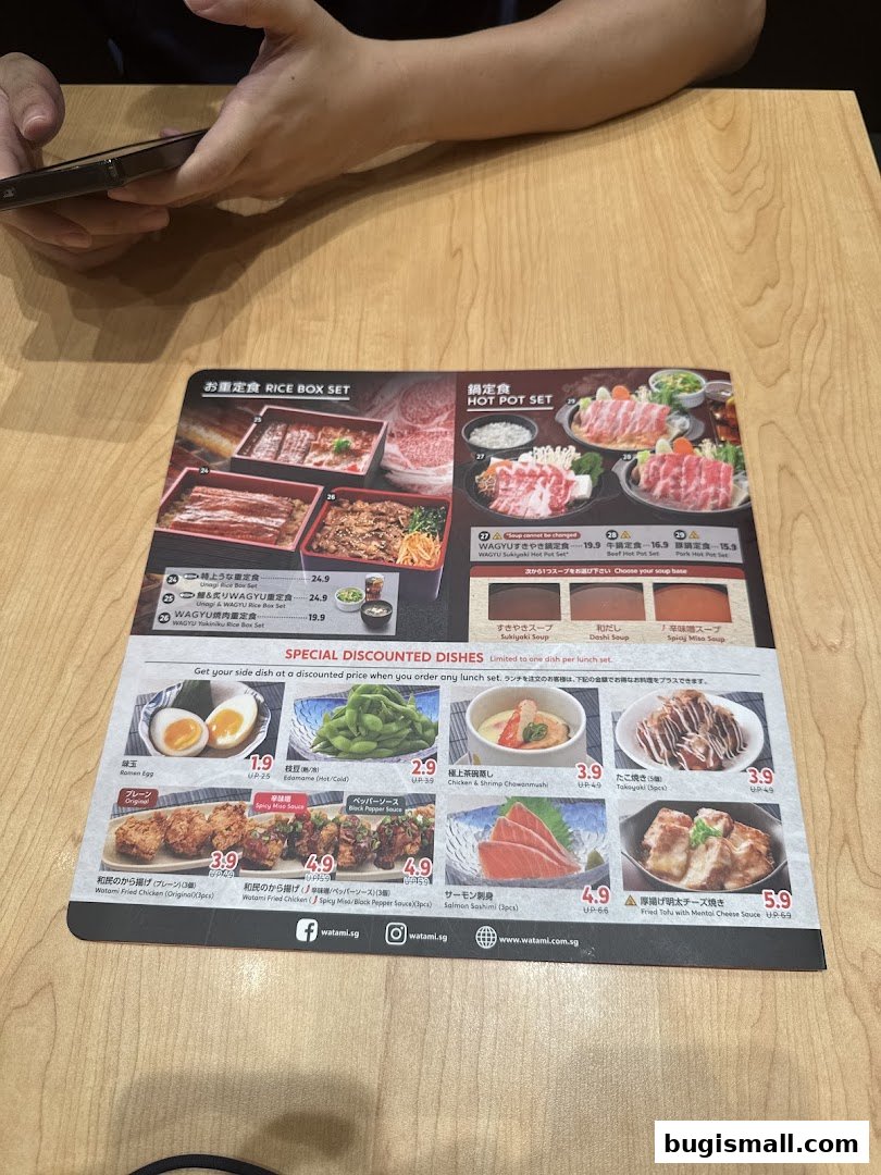 A menu from Watami Japanese Dining featuring rice box sets, hot pot sets, and special discounted dishes.