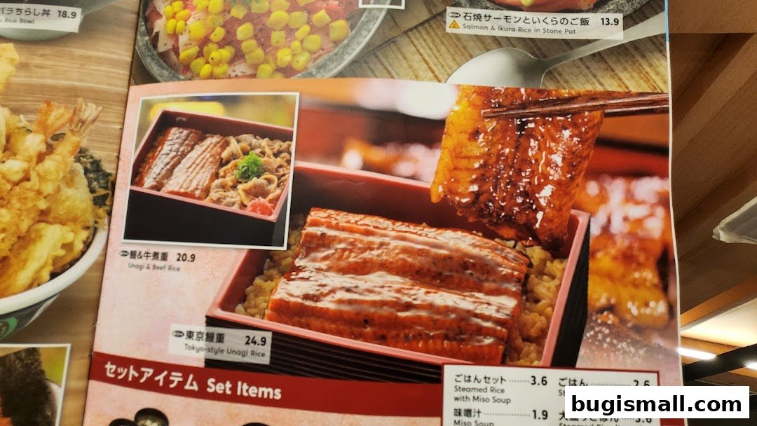 A close-up of a Japanese restaurant menu featuring Unagi and Beef Rice, and Tokyo-style Unagi Rice.