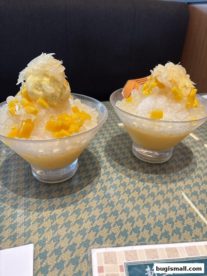 Two refreshing mango sago desserts with ice cream and pomelo at Xin Wang Hong Kong Café.