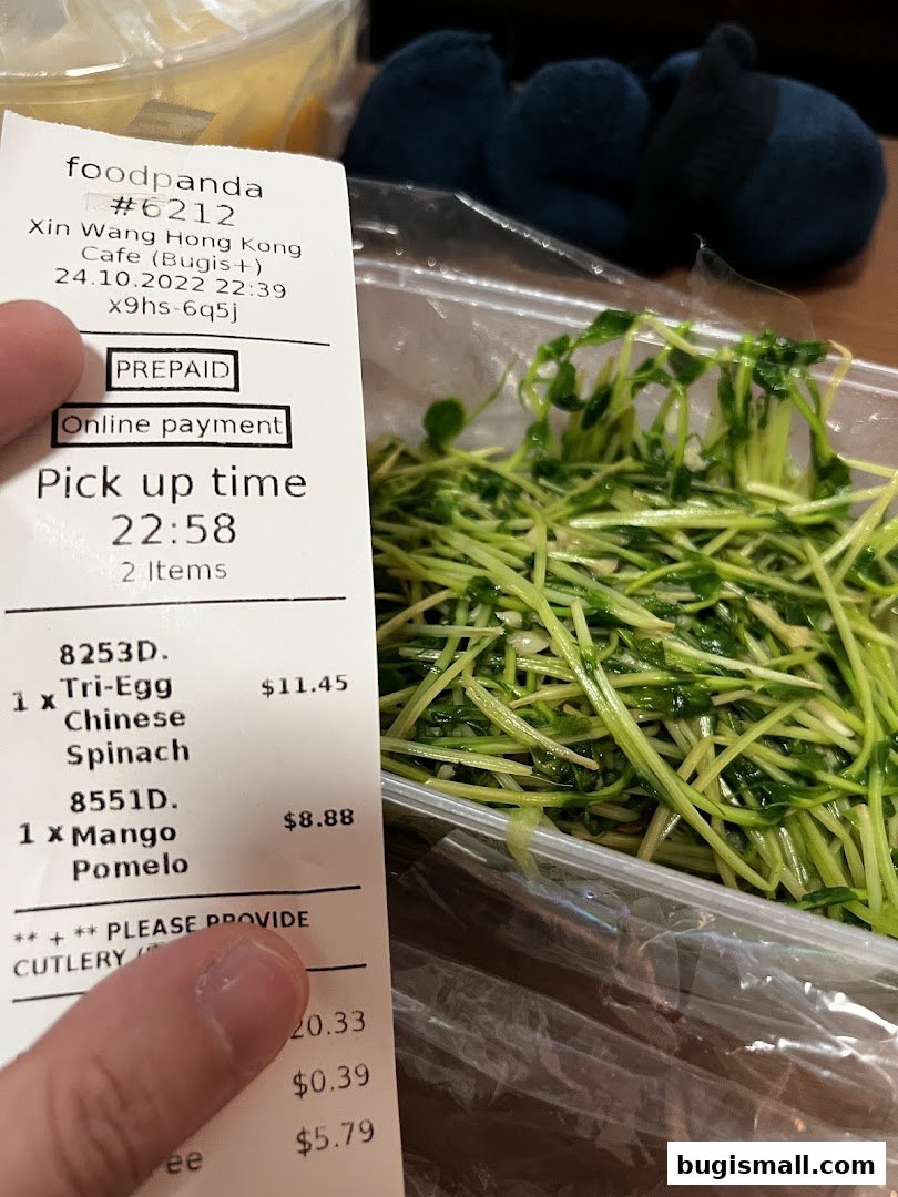 A receipt from Xin Wang Hong Kong Cafe shows a food order with two items and their prices.