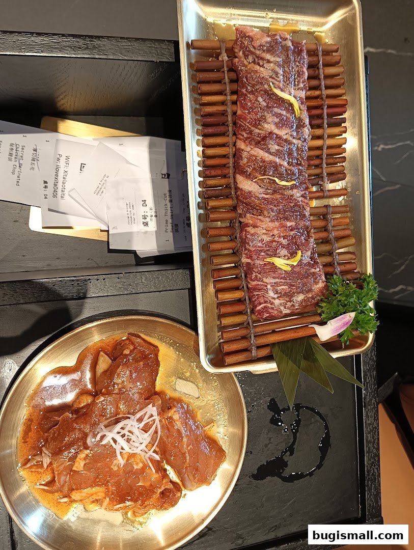Two plates of raw, marinated meat, one thinly sliced and the other in larger pieces, ready for cooking.