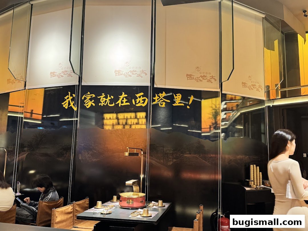 Interior of a restaurant with tables set for dining and decorative elements on the walls.