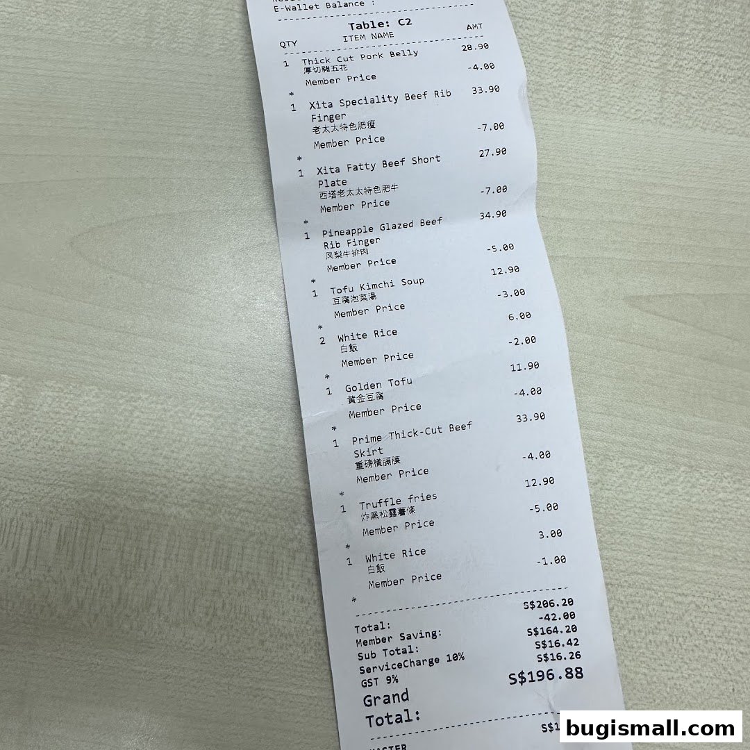 A receipt from Xita Lao Tai Tai Singapore detailing food items and prices.