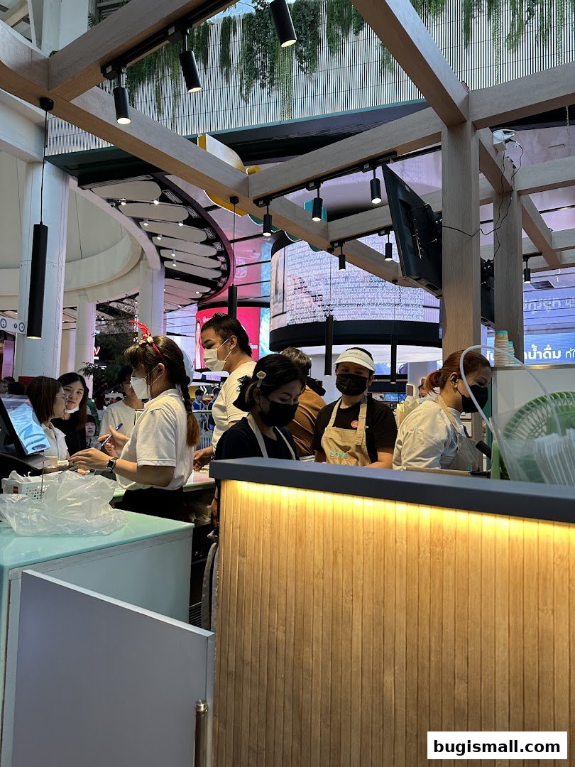Staff members working behind a counter at Yolé Bugis.