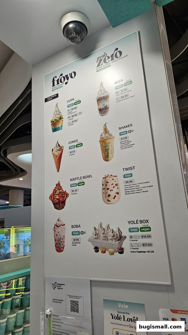 A menu board displaying various froyo and vegan dessert options from Yolé.